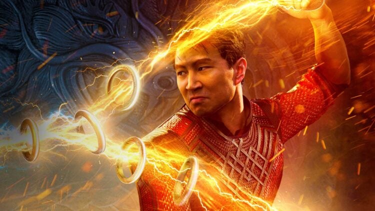 Shang-Chi (Simu Liu) commands the Ten Rings with golden lightning in a promotional image for Shang-Chi and the Legend of the Ten Rings