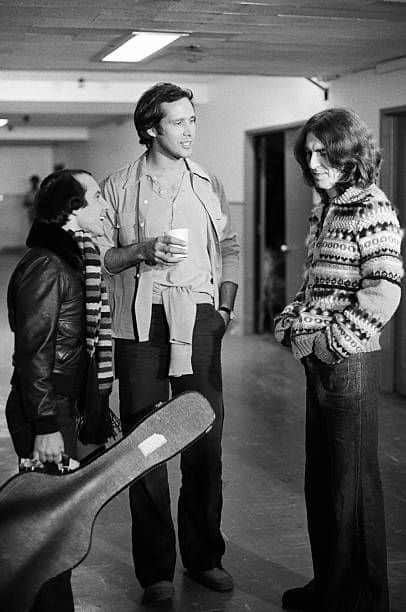 Paul Simon, Chevy Chase and George Harrison in 1976 SNL
