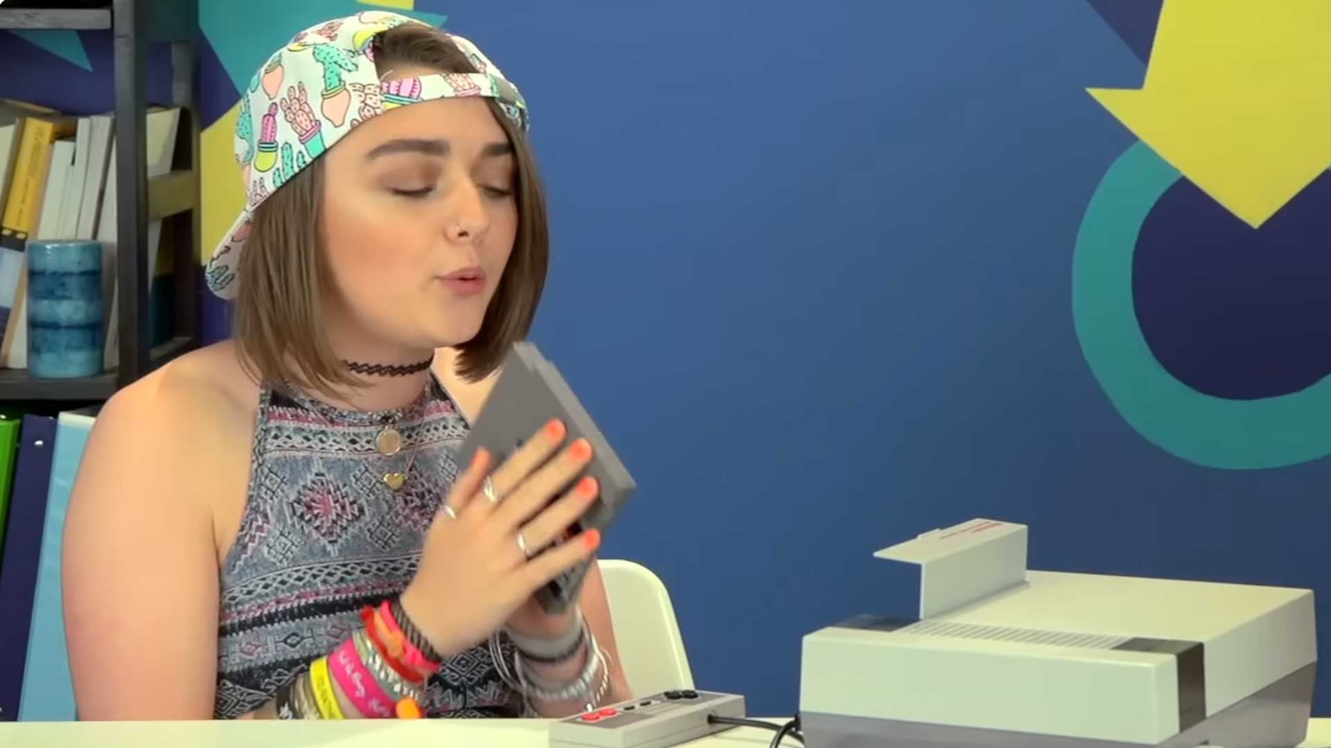 Maisie Williams Blows Nintendo Cartridge