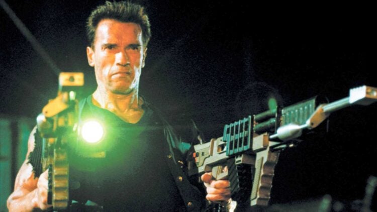 Arnold Schwarzenegger as John Kruger with electromagnetic rail guns in Eraser