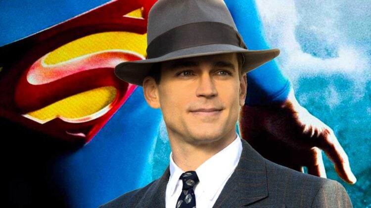 Matt Bomer in a suit and fedora in front of the Superman logo