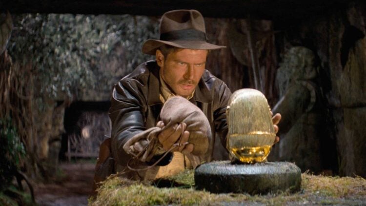 Harrison Ford as Indiana Jones attempts to swap the golden idol in Raiders of the Lost Ark (1981)