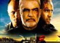 Nicolas Cage, Sean Connery, and Ed Harris in The Rock (1996), with Alcatraz exploding behind them at sunset