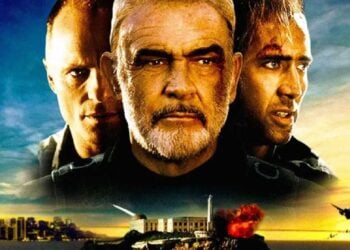 Nicolas Cage, Sean Connery, and Ed Harris in The Rock (1996), with Alcatraz exploding behind them at sunset