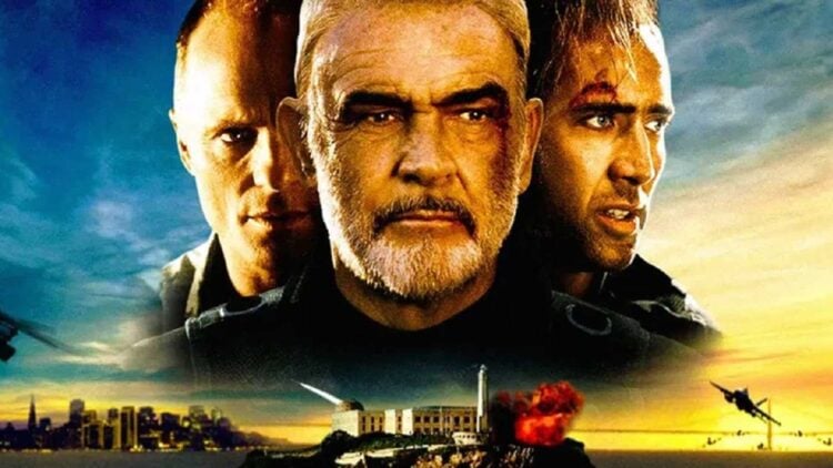 Nicolas Cage, Sean Connery, and Ed Harris in The Rock (1996), with Alcatraz exploding behind them at sunset
