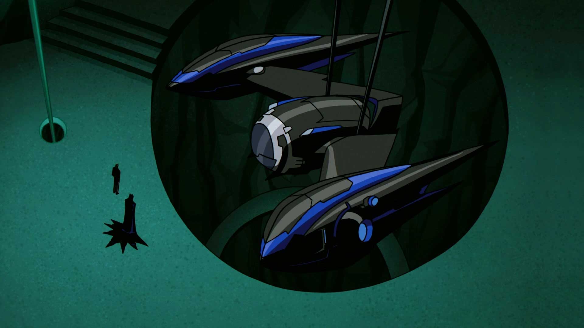 Twin Batplane aircraft with bat-winged silhouettes parked inside a hidden Batcave hangar bay