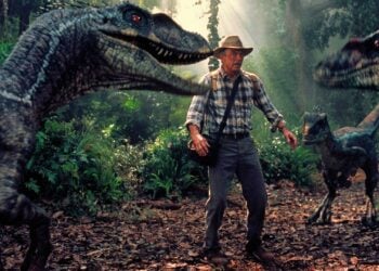 Sam Neill as Dr. Alan Grant flanked by two Velociraptors in Jurassic Park III