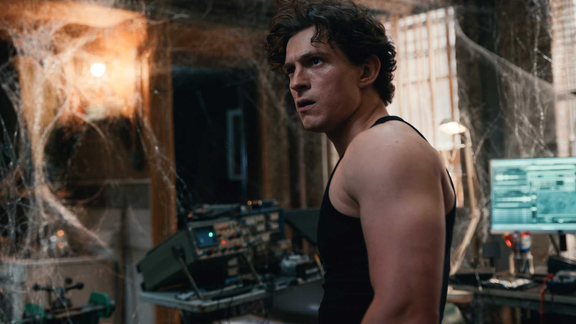 Tom Holland's Peter Parker stands in a web-covered apartment in Spider-Man: Brand New Day