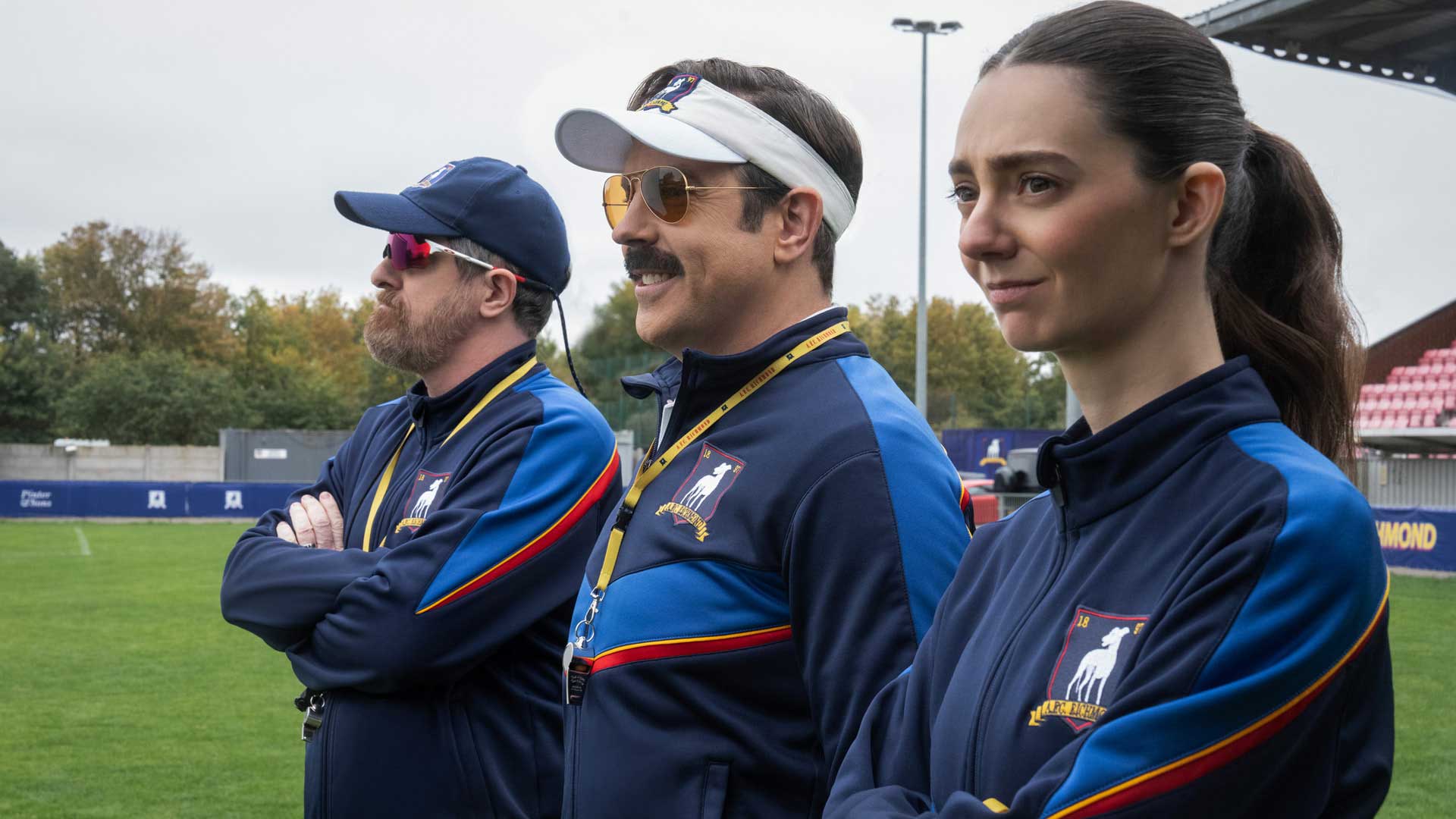 Brendan Hunt, Jason Sudeikis and Tanya Reynolds in Ted Lasso