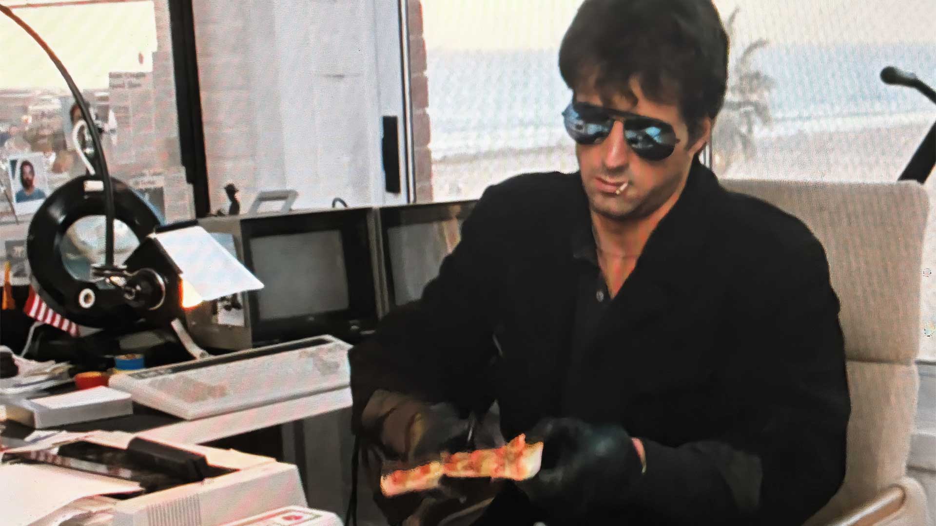 Sylvester Stallone Cobra cutting pizza