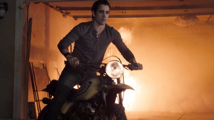 Colin Farrell as Jerry Dandridge riding a motorcycle out of a burning garage in Fright Night (2011)