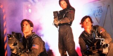 Three Space: Above and Beyond cast members in combat gear crouched with weapons raised